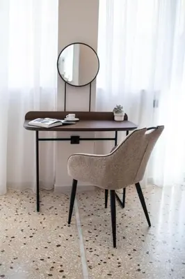 a desk with a mirror and a chair at Mythodea Athens Suites in Athens