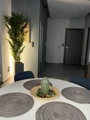 a cactus sitting on top of a table in a room at Live Minimal in Athens