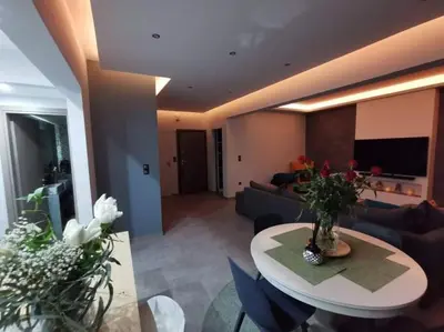 a living room with a couch and a table at Live Minimal in Athens