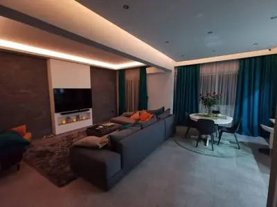 a living room with a couch and a table at Live Minimal in Athens