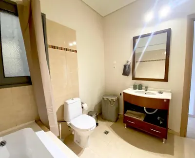a bathroom with a toilet and a sink and a mirror at Cleo in Spáta
