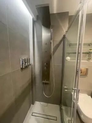 a bathroom with a shower and a toilet at Feel like home in Athens