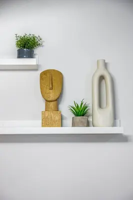 a shelf with vases and plants on it at Feel like home in Athens