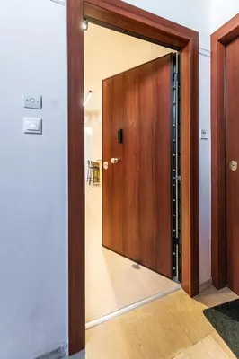 a door with a mirror in a hallway at Feel like home in Athens