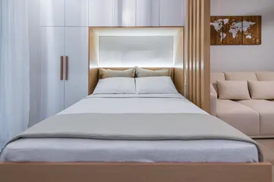 a bedroom with a large bed and a couch at Feel like home in Athens
