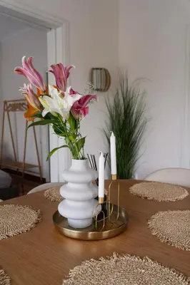 a vase of flowers on a table with candles at Visum Acropol ,3BR - Private Terrace-Jacuzzi - Amazing View in Athens