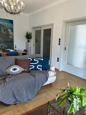 a living room with a couch and a table at 2 BD Apt in Syntagma with Acropolis view in Athens