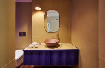 a bathroom with a bowl sink and a mirror at LOOM ATHENS in Athens