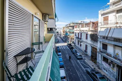 a view of a city street from a balcony at James - 2BR in the Heart of Ancient Athens in Athens