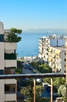a view of a city with buildings and the ocean at Athens Riviera Modern Penthouse with Sea View in Athens