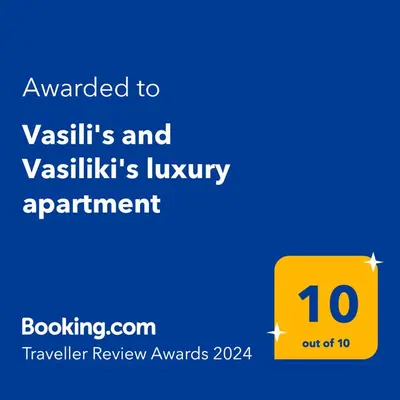 a yellow sign that reads awarded to vashikis and yakikiikis at Vasili's and Vasiliki's luxury apartment in Athens