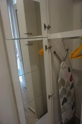 a shower with a glass door in a bathroom at Vasili's and Vasiliki's luxury apartment in Athens