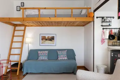 a living room with a bunk bed and a couch at Rooftop Athens Central Studio in Athens