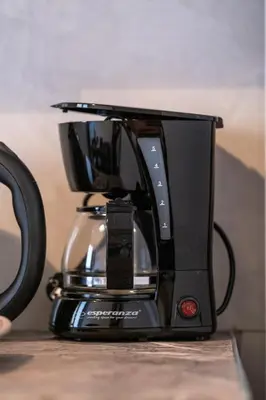 a black coffee maker sitting on a table at SOKOS Residence, 1' walk from Aghios Ioannis Metro in Athens