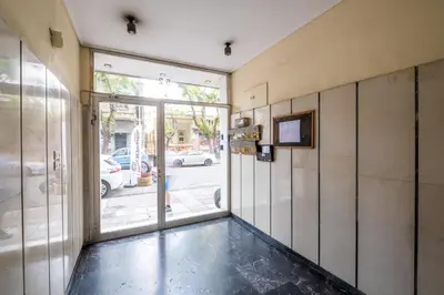 an empty room with a door to a street at SOKOS Residence, 1' walk from Aghios Ioannis Metro in Athens
