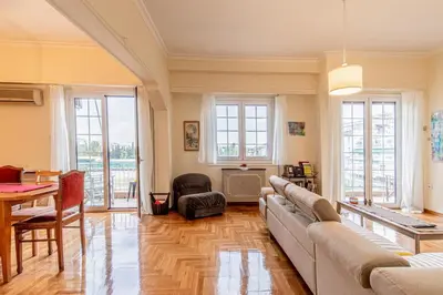 a living room with a couch and a table at Athens Cityscape in Athens