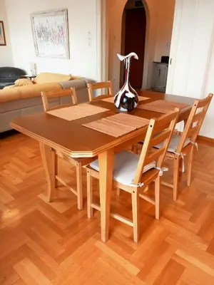 a dining room table with chairs and a couch at Athens Cityscape in Athens