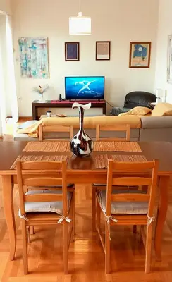 a living room with a table and a couch at Athens Cityscape in Athens