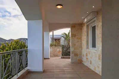 a hallway of a house with a balcony at Eternal Summer Time Villa for 6 by Filos Inc in Dhaskalión