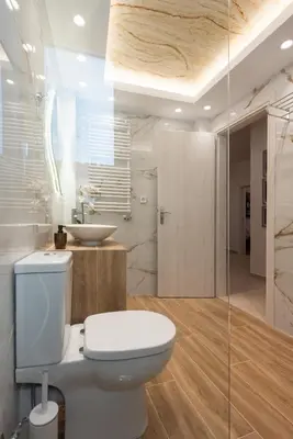 a bathroom with a toilet and a sink at Blue Ark Acropolis Compass in Athens
