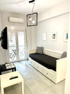 a bedroom with a large bed in a room at Harmony apartment next to the Acropolis museum in Athens
