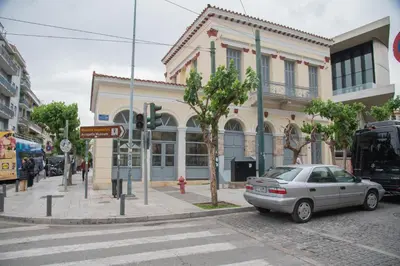 a car parked on a street in front of a building at Harmony apartment next to the Acropolis museum in Athens