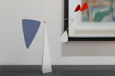 a red and blue object standing next to a window at The Urban Nest Design 1BR in Trendy Kerameikos in Athens