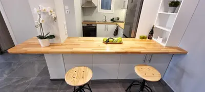 a kitchen with a counter with a bowl of fruit on it at Cozy & modern apartment near Panathenaic Stadium in Athens