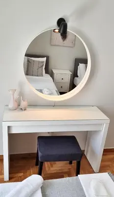 a bedroom with a white desk with a mirror at Cozy & modern apartment near Panathenaic Stadium in Athens