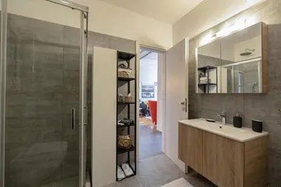 a bathroom with a sink and a shower at Cozy & modern apartment near Panathenaic Stadium in Athens