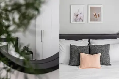 a bedroom with a bed with a pink pillow at Sublime 1BR Apartment in Koukaki by UPSTREET in Athens