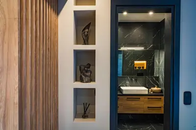 a bathroom with a sink and a mirror at Aeanos suite in Athens