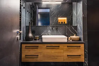 a bathroom with a sink and a mirror at Aeanos suite in Athens