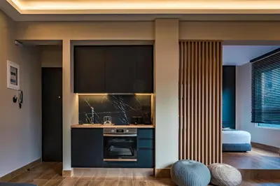 a kitchen with a sink and a stove at Aeanos suite in Athens