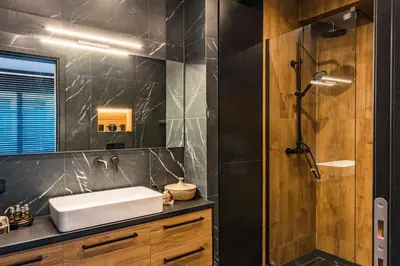 a bathroom with a sink and a shower at Aeanos suite in Athens