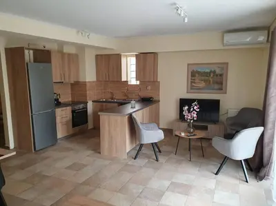 a kitchen with a table and chairs in a room at Lux & Style 75sqm with Private Parking in Athens in Athens