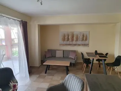 a living room with a couch and a table at Lux & Style 75sqm with Private Parking in Athens in Athens