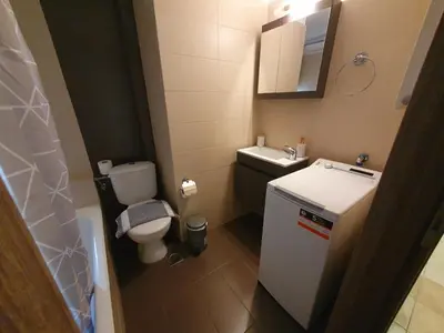 a small bathroom with a toilet and a sink at Lux & Style 75sqm with Private Parking in Athens in Athens