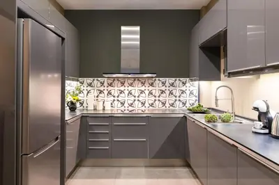 a kitchen with gray cabinets and stainless steel appliances at Exclusive Acropolis 4BDR Large Residence in Athens