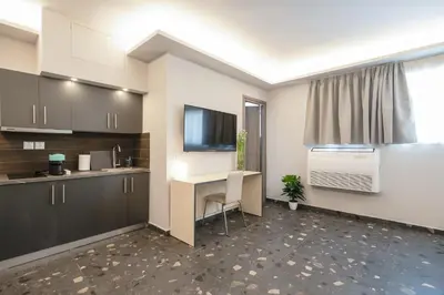 a kitchen with a desk and a computer in it at City Life Athens Apartments in Athens