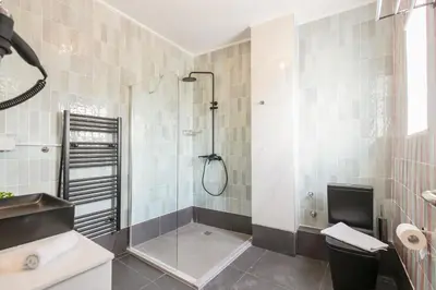 a bathroom with a shower and a sink at City Life Athens Apartments in Athens