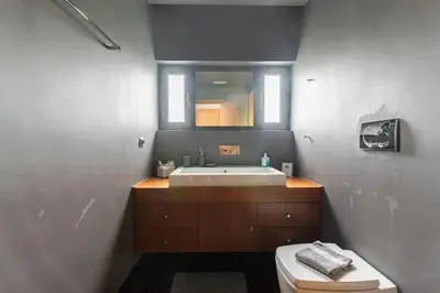 a bathroom with a sink and a toilet at Magnificent, Deluxe Villa, Lagonisi, Athens Riviera in Áyios Nikólaos