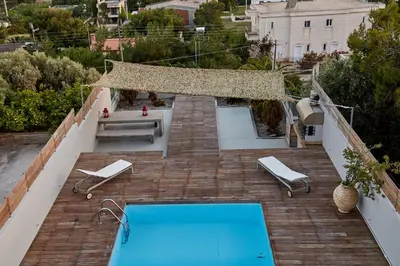 a swimming pool on the roof of a house at Magnificent, Deluxe Villa, Lagonisi, Athens Riviera in Áyios Nikólaos