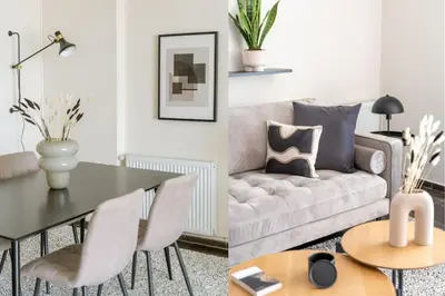 a living room with a couch and a table at Serene 2BR Apartment in Alimos with Sea view by UPSTREET in Athens