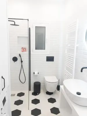 a bathroom with a toilet and a sink at NobleNotes - Victor Suite Central Athens in Athens