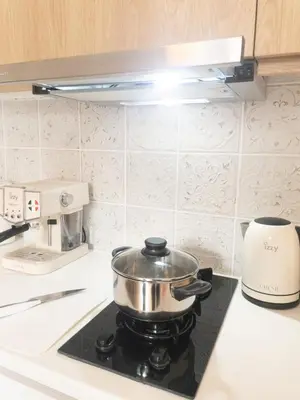 a pot on top of a stove in a kitchen at NobleNotes - Victor Suite Central Athens in Athens