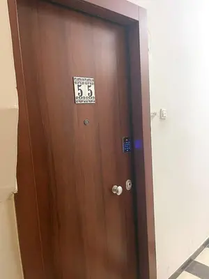 a brown door with a sign on it at Apartment 55 Fix in Athens