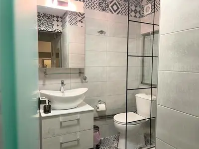 a bathroom with a sink and a toilet at Apartment 55 Fix in Athens