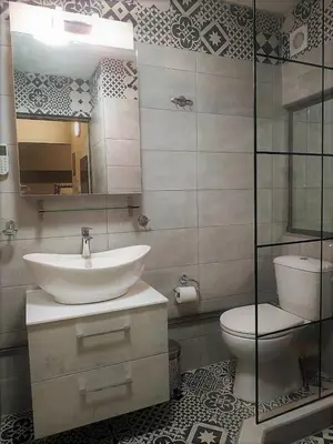 a bathroom with a sink and a toilet at Apartment 55 Fix in Athens