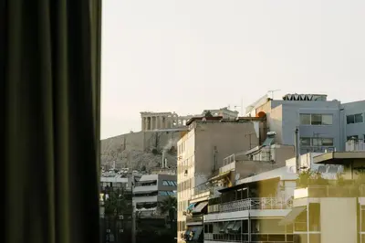 a view of a city from a window at Acropolis view apartment in Athens in Athens